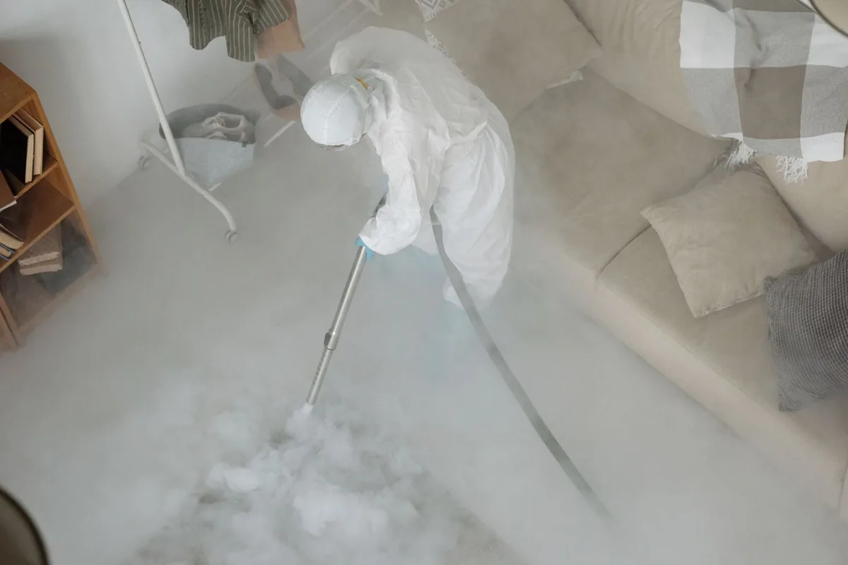 Biohazard cleanup technician in protective equipment, Elkton, KY